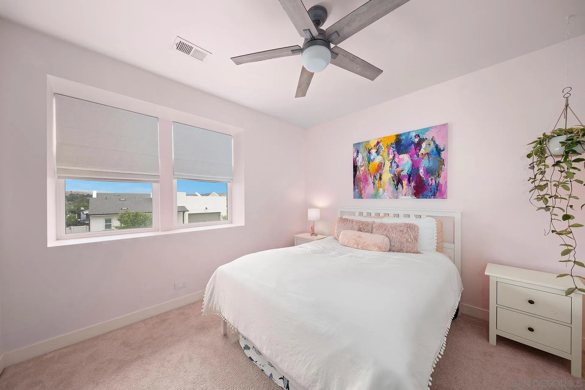 8850 Weston Road Santee, CA 92071 - Photo 31 of 44 a bedroom with a bed and a chandelier