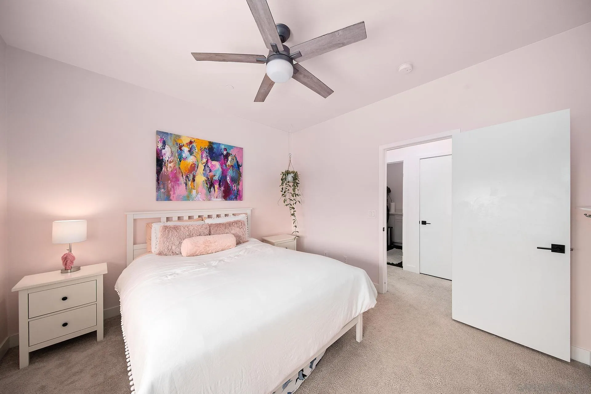 8850 Weston Road Santee, CA 92071 - Photo 33 of 44 a bedroom with a bed and a chandelier