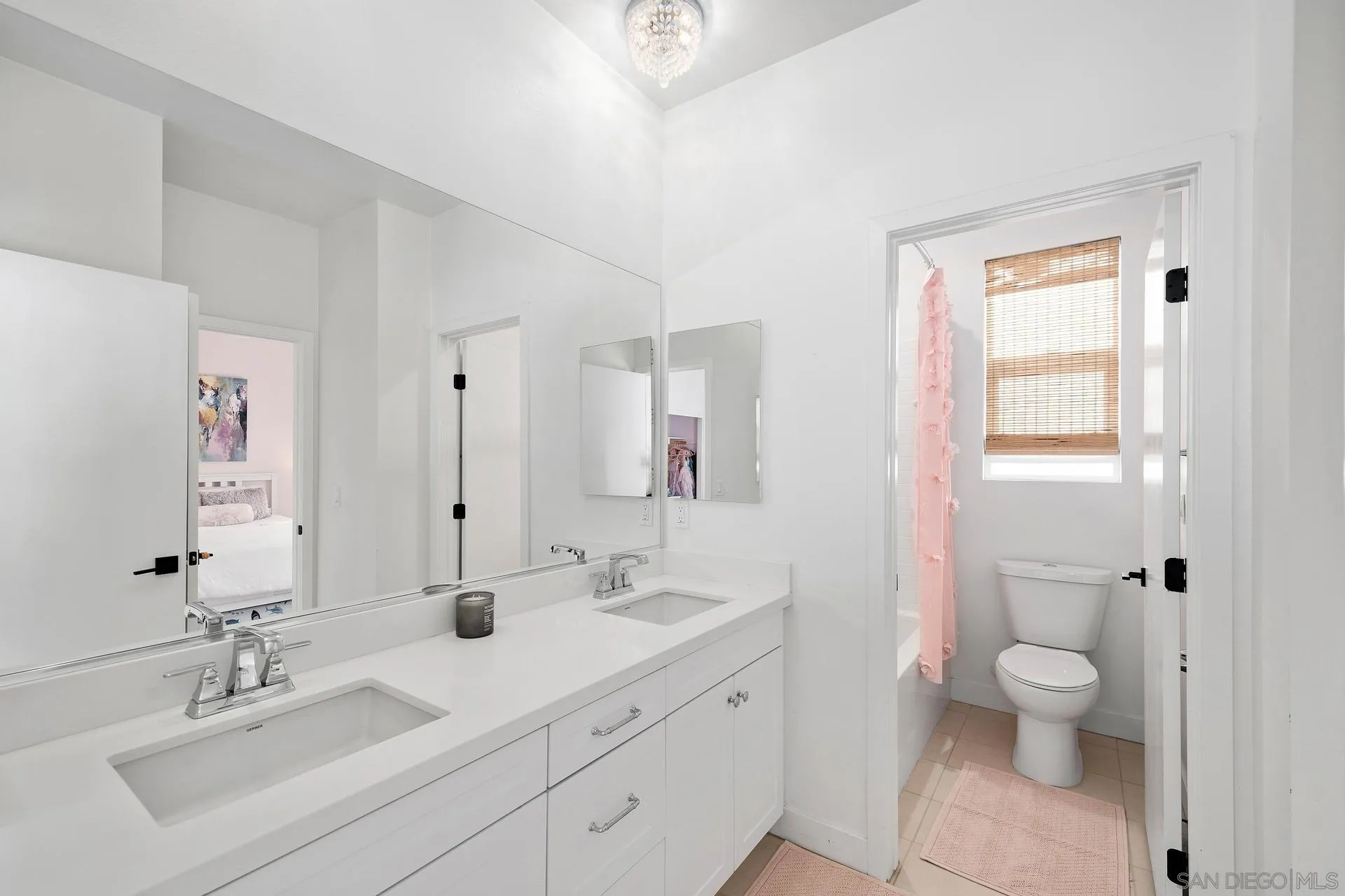 8850 Weston Road Santee, CA 92071 - Photo 35 of 44 a bathroom with a sink a toilet and a large mirror