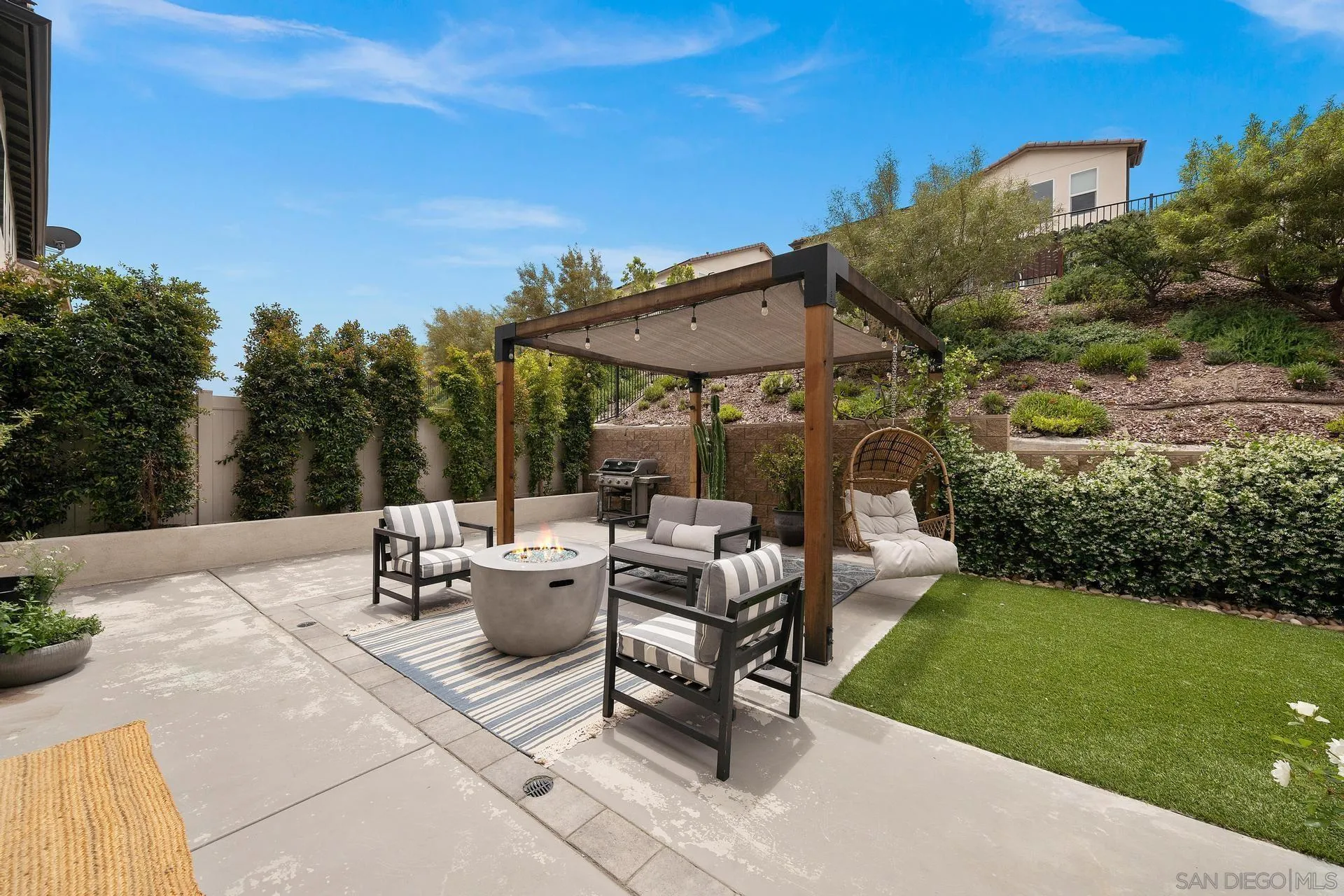8850 Weston Road Santee, CA 92071 - Photo 41 of 44 a view of a patio with couches and table and chairs and garden