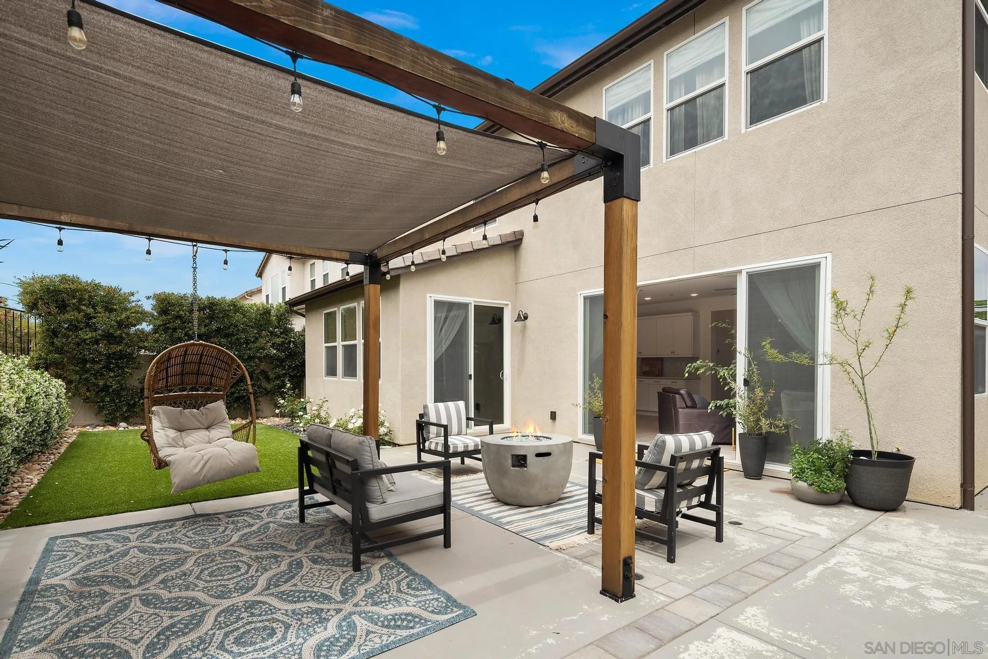8850 Weston Road Santee, CA 92071 - Photo 43 of 44 a view of a patio with table and chairs and potted plants