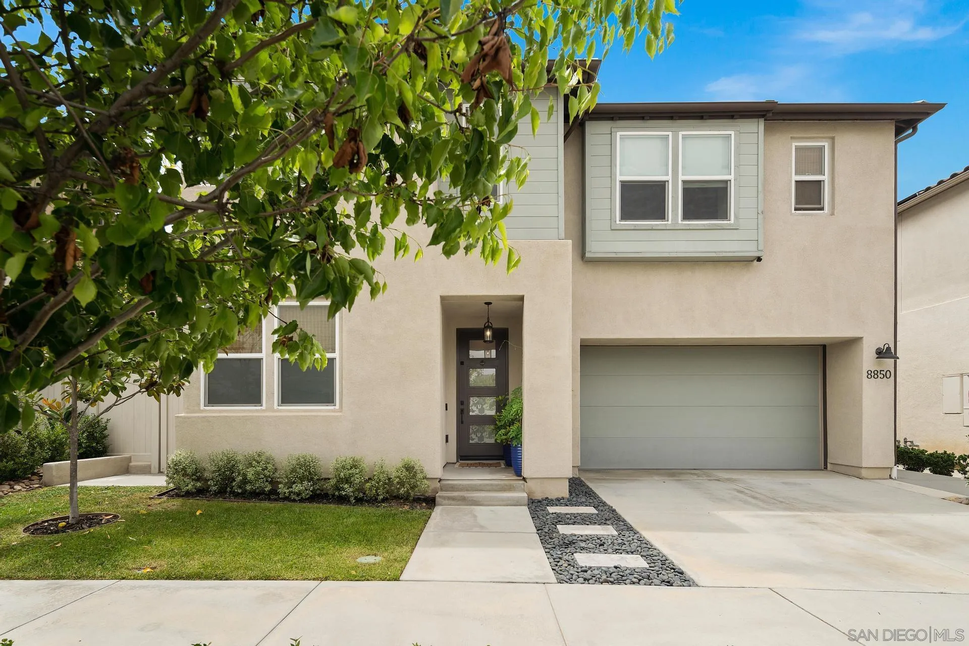 8850 Weston Road Santee, CA 92071 - Photo 44 of 44 a front view of a house with a garden