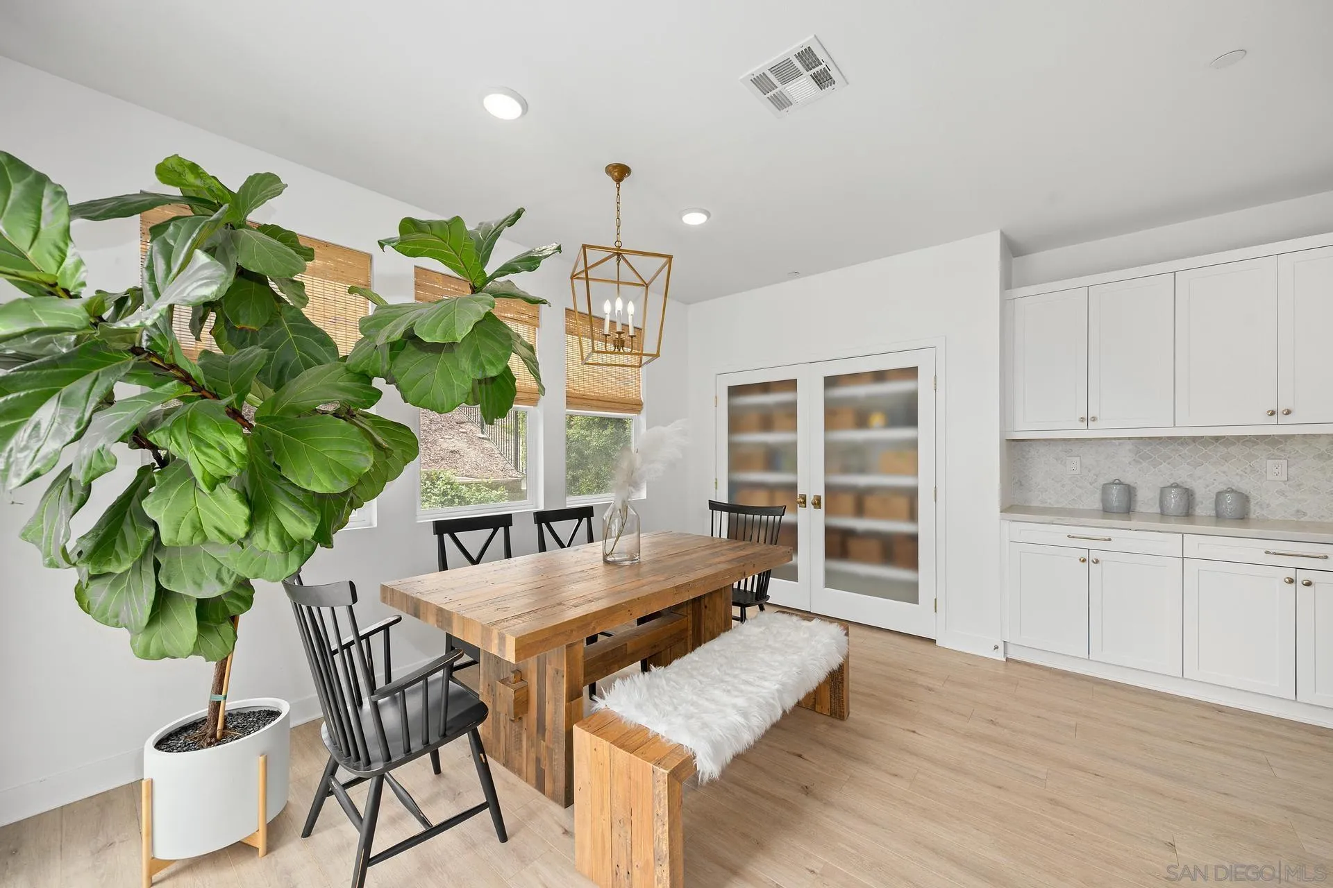 8850 Weston Road Santee, CA 92071 - Photo 10 of 44 a living room with furniture a potted plant and wooden floor