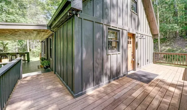 a view of a house with a backyard