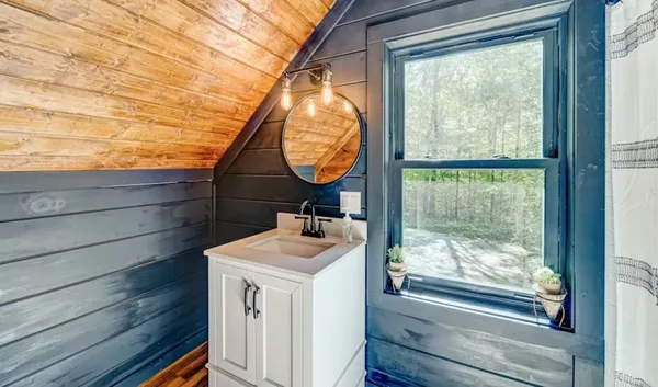 a bathroom with a sink and mirror
