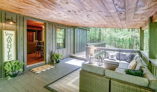 a outdoor space with patio the couches and a dining table with garden view