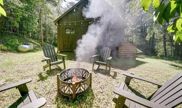 a view of a chairs and table in patio