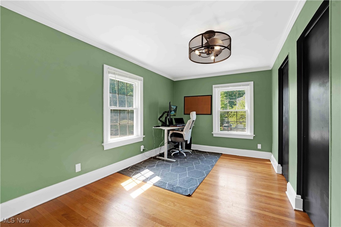 685 Ecton Road Akron, OH 44303 - Photo 25 of 34 Office area featuring ornamental molding, healthy amount of natural light, a chandelier, and wood finished floors