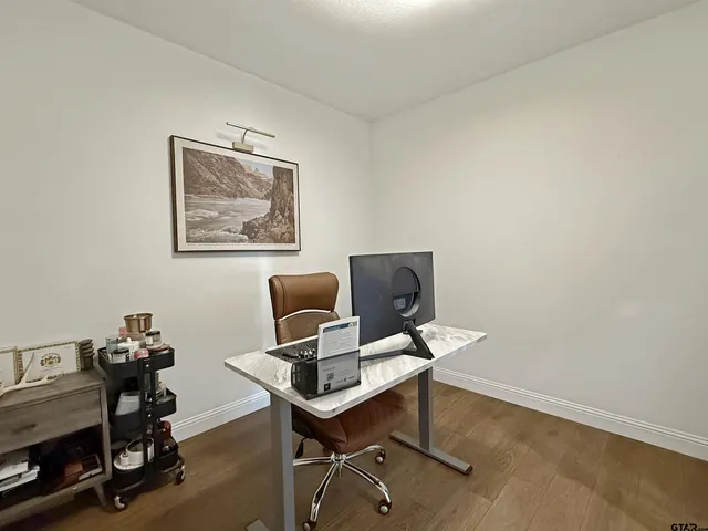 a view of a workspace with furniture