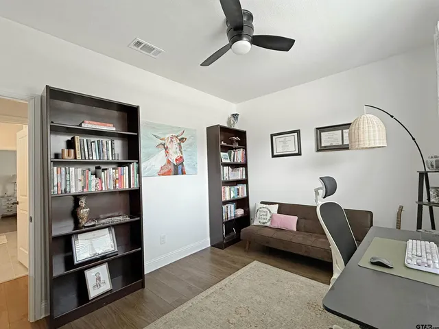 a bedroom with a workspace