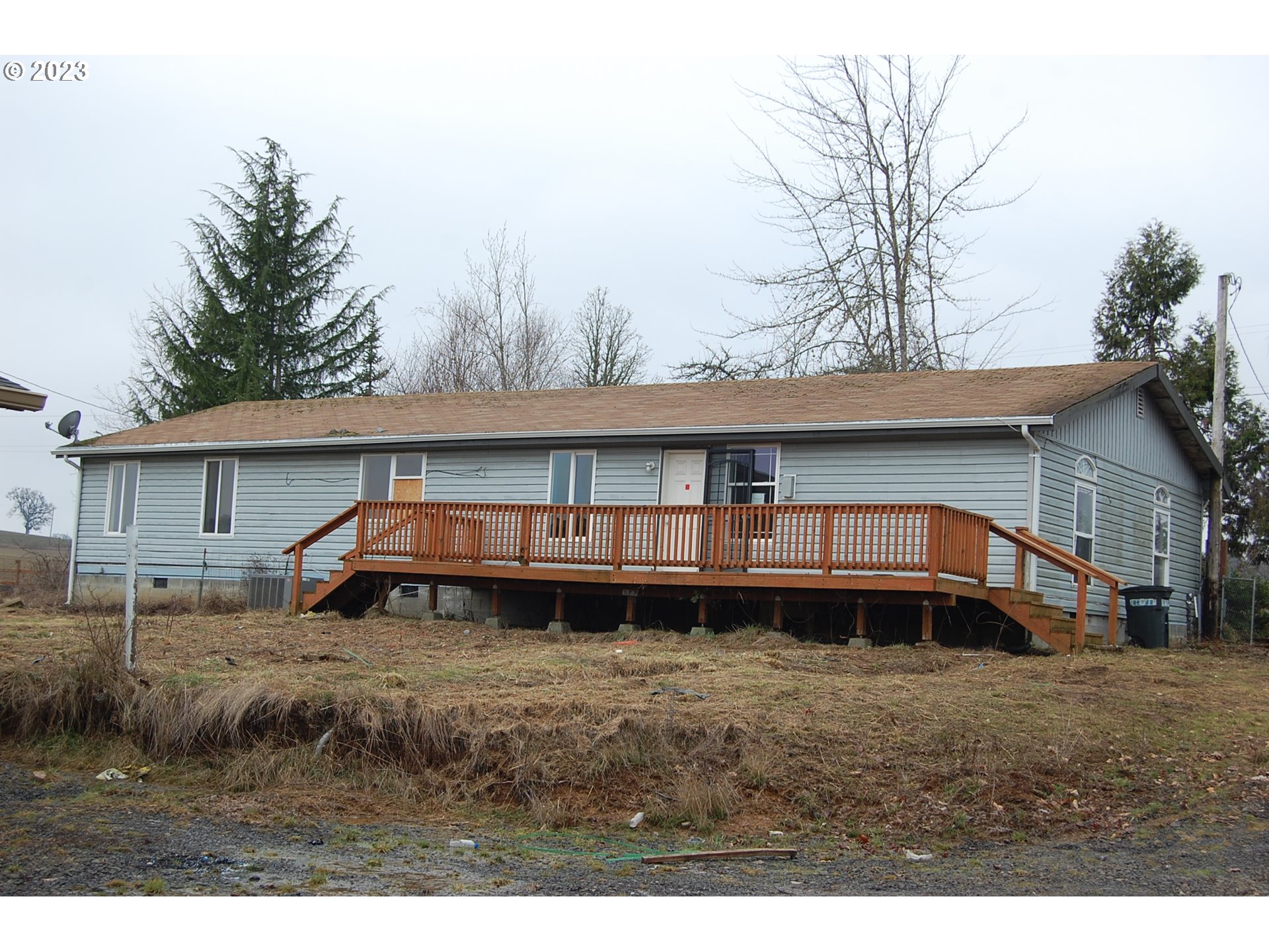 8850 Red Prairie Road Sheridan, OR 97378 - Photo 2 of 26 a view of a house with a yard and sitting area
