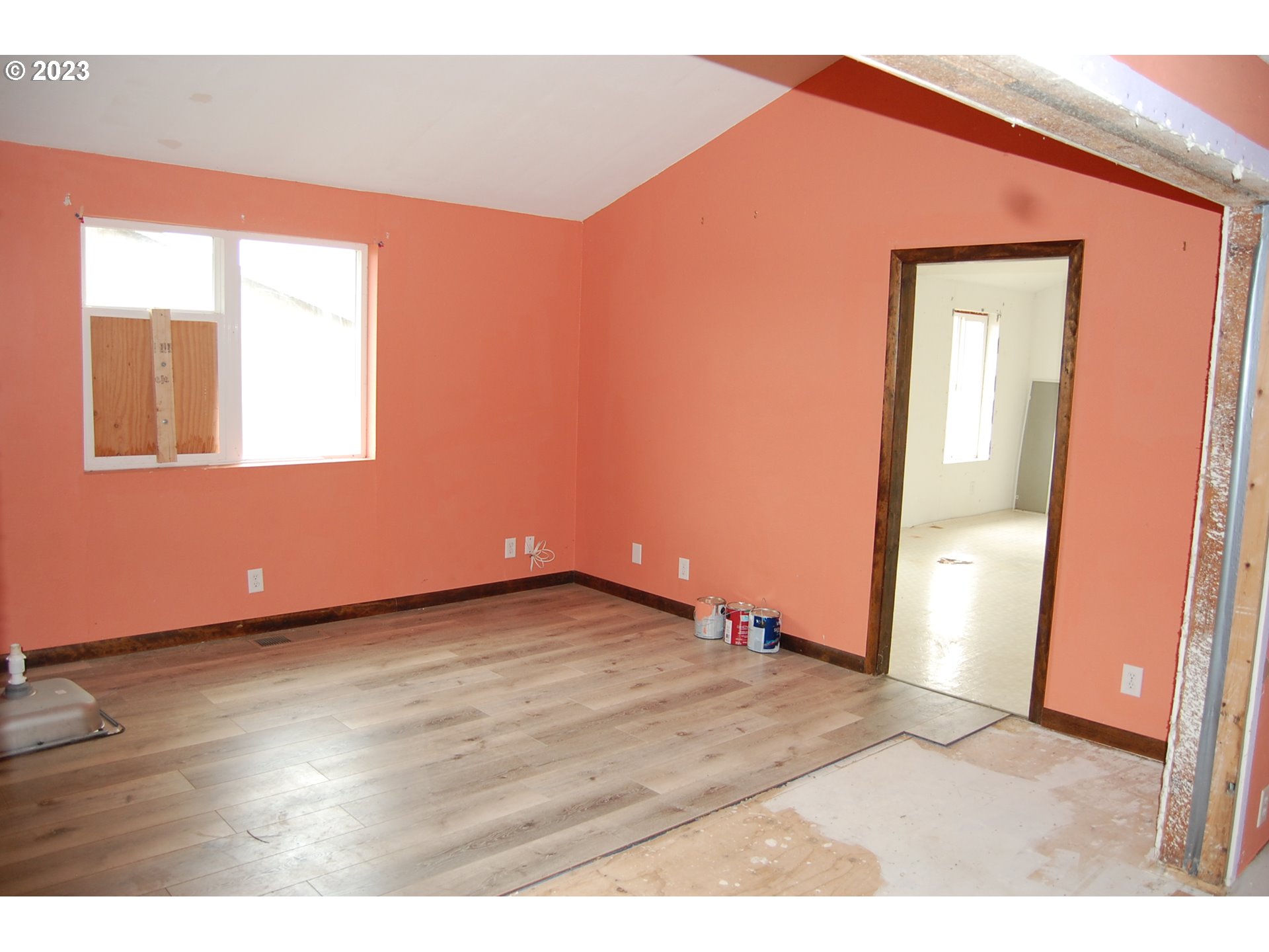 8850 Red Prairie Road Sheridan, OR 97378 - Photo 24 of 26 a view of an empty room with wooden floor and a window