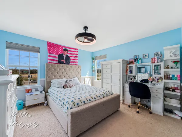 a bedroom with a bed and cabinets
