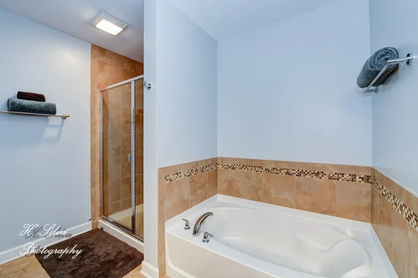 a bathroom with a bathtub and shower