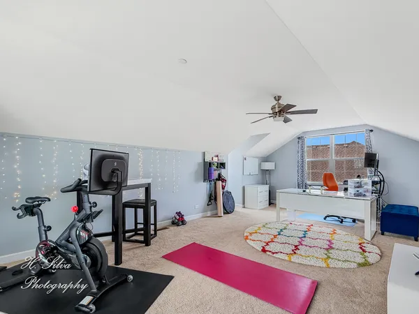 a bedroom with furniture and a wooden floor