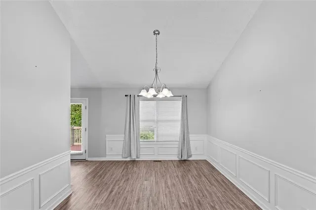 a view of a room with window and wooden floor