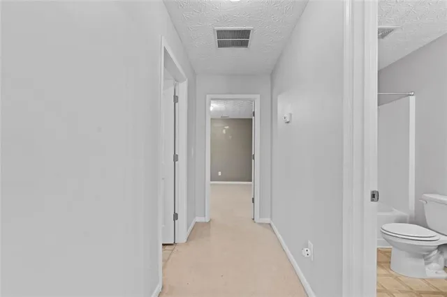 a view of a livingroom with a ceiling fan and window