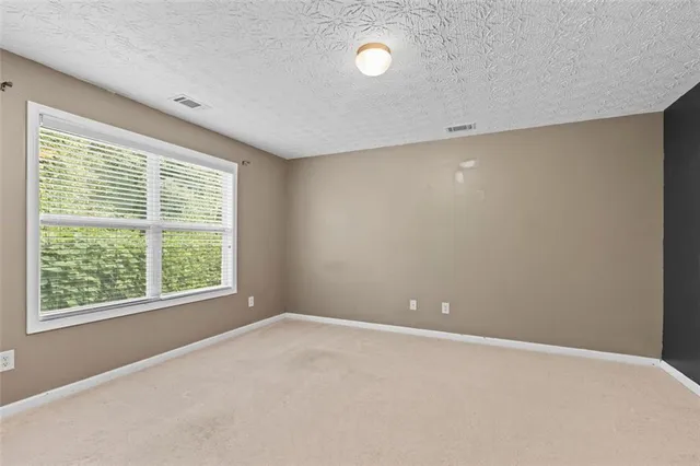 a balcony view with a seating space