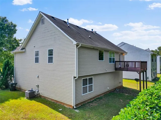 an aerial view of residential house with outdoor space and swimming pool