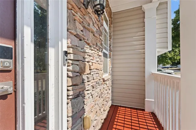 a view of a wooden door and a window