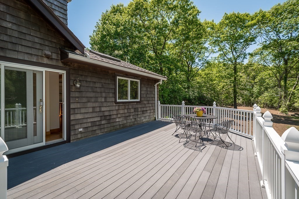 20 R Edgemoor Road Gloucester, MA 01930 - Photo 15 of 33 a balcony with wooden floor table and chairs