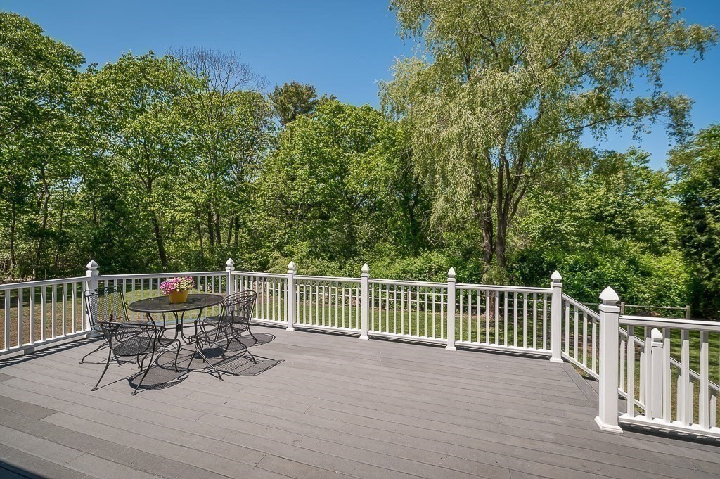 20 R Edgemoor Road Gloucester, MA 01930 - Photo 16 of 33 a view of a patio with a table and chairs