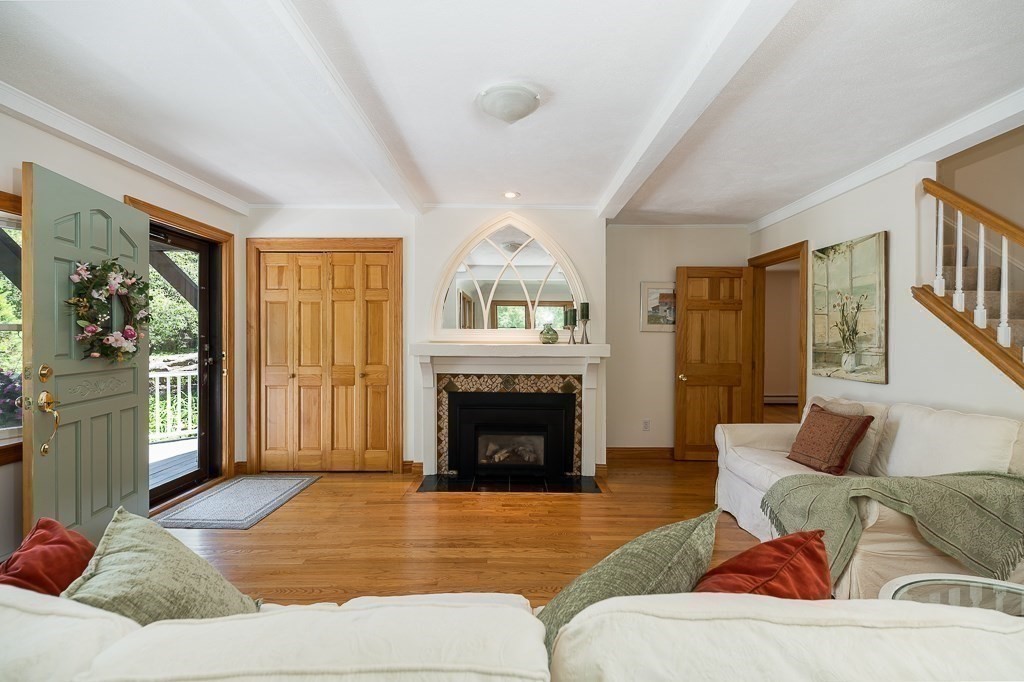 20 R Edgemoor Road Gloucester, MA 01930 - Photo 21 of 33 a living room with furniture and a fireplace