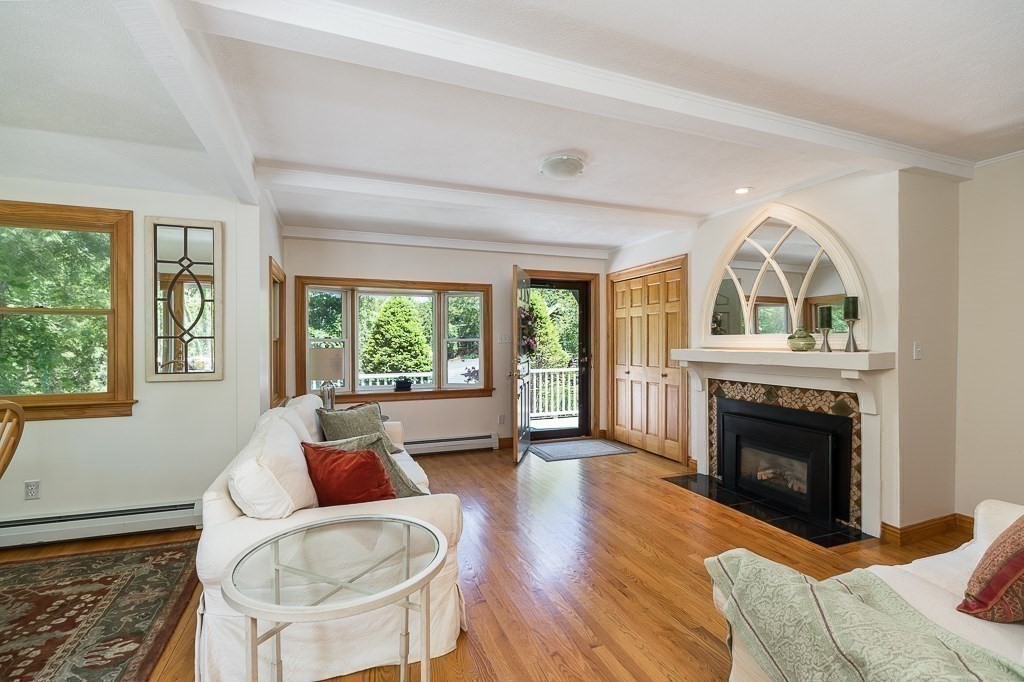 20 R Edgemoor Road Gloucester, MA 01930 - Photo 22 of 33 a living room with furniture and a fireplace