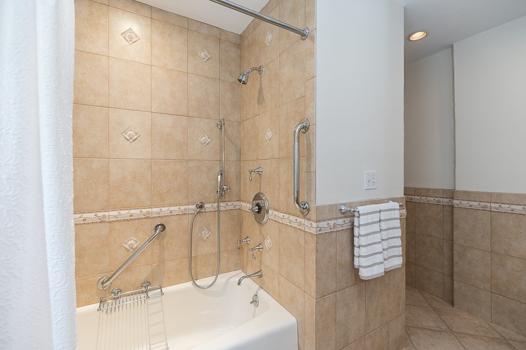 20 R Edgemoor Road Gloucester, MA 01930 - Photo 25 of 33 a bathroom with a bathtub and shower