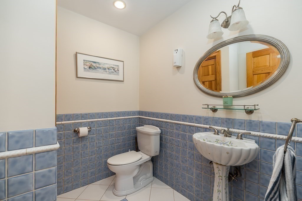 20 R Edgemoor Road Gloucester, MA 01930 - Photo 29 of 33 a bathroom with a toilet a sink and a mirror