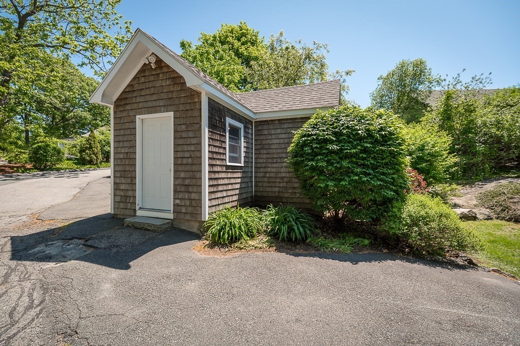 20 R Edgemoor Road Gloucester, MA 01930 - Photo 7 of 33 a front view of a house with a yard and garage