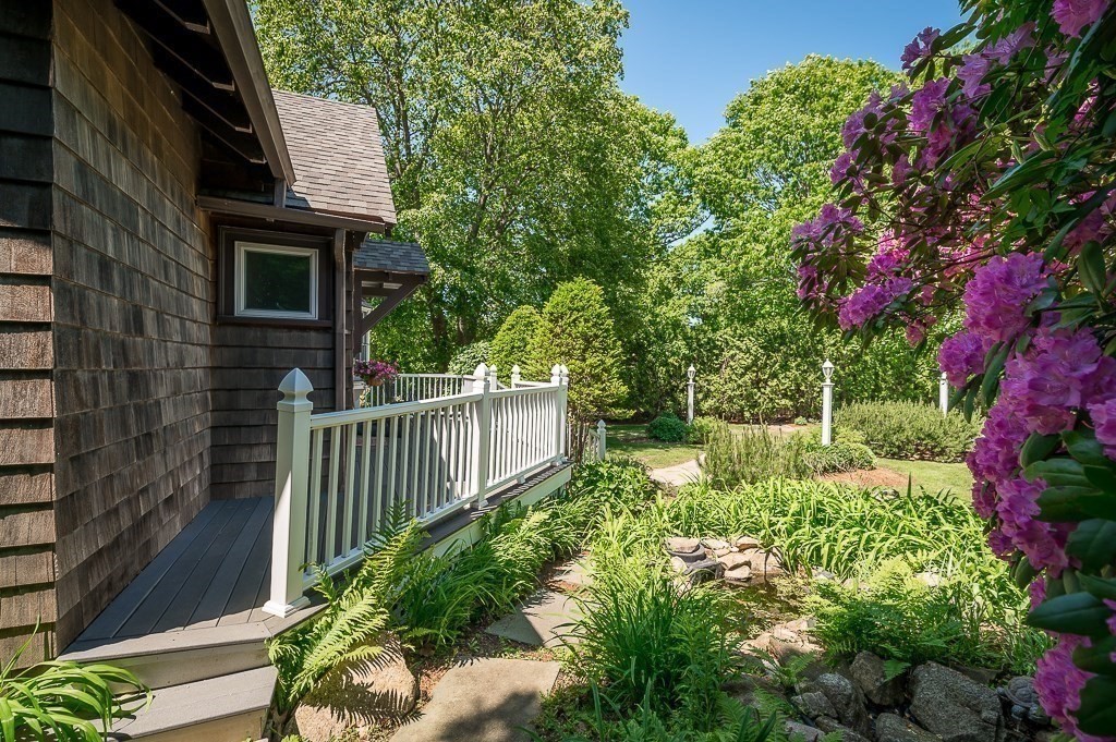20 R Edgemoor Road Gloucester, MA 01930 - Photo 10 of 33 a balcony with lots of flowers and trees