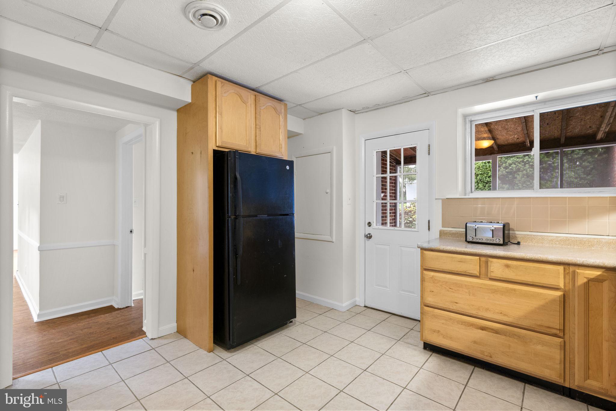 9194 Old Frederick Road Ellicott City, MD 21042 - Photo 39 of 50 Lower level 2nd kitchen w/door to screened patio