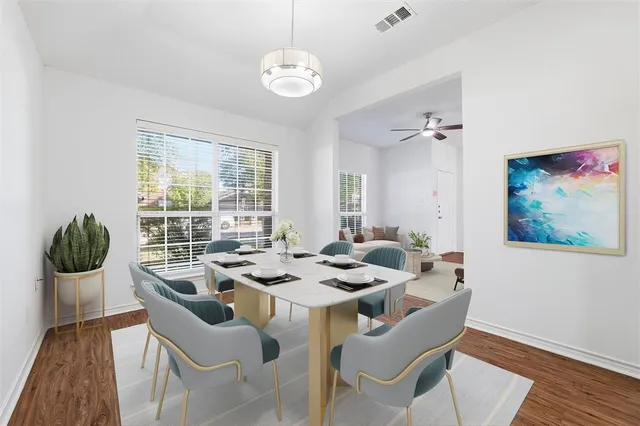 a dining room with furniture and window