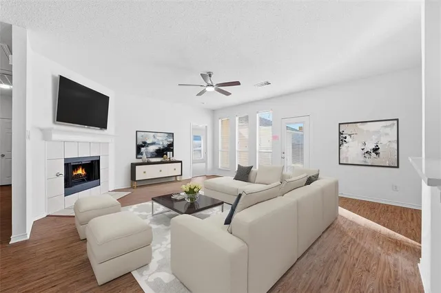 a living room with furniture fireplace and a flat screen tv