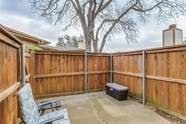 a view of outdoor space with wooden floor
