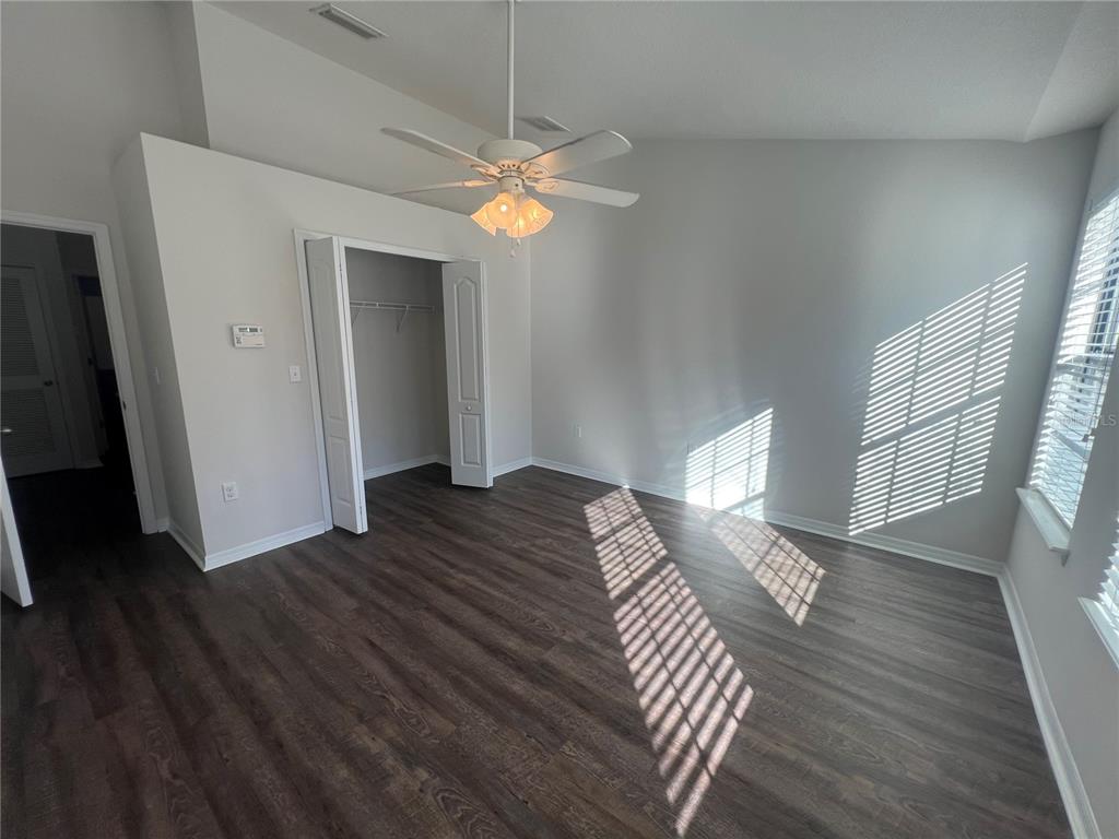 5706 Kingletsound Lithia, FL 33547 - Photo 8 of 16 a view of bedroom with wooden floor