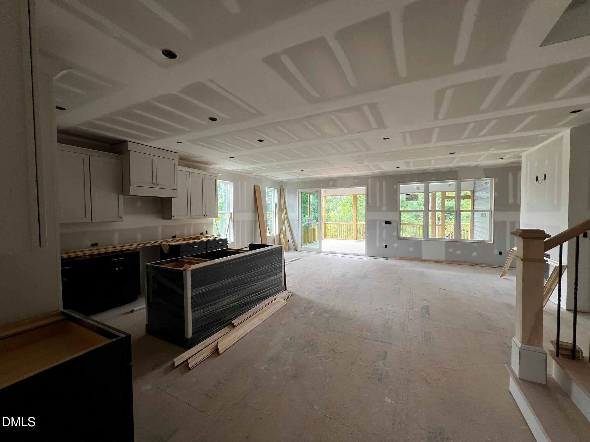 1675 Terry Road Durham, NC 27712 - Photo 2 of 23 a kitchen with granite countertop a stove and a refrigerator