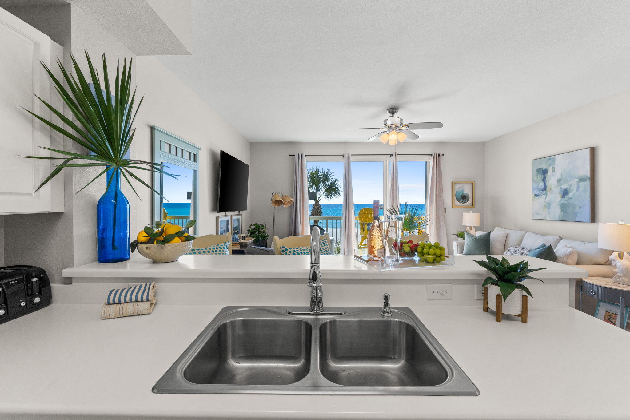 17757 Front Beach Road, Unit 104 Panama City Beach, FL 32413 - Photo 12 of 40 a kitchen with a sink and a chandelier