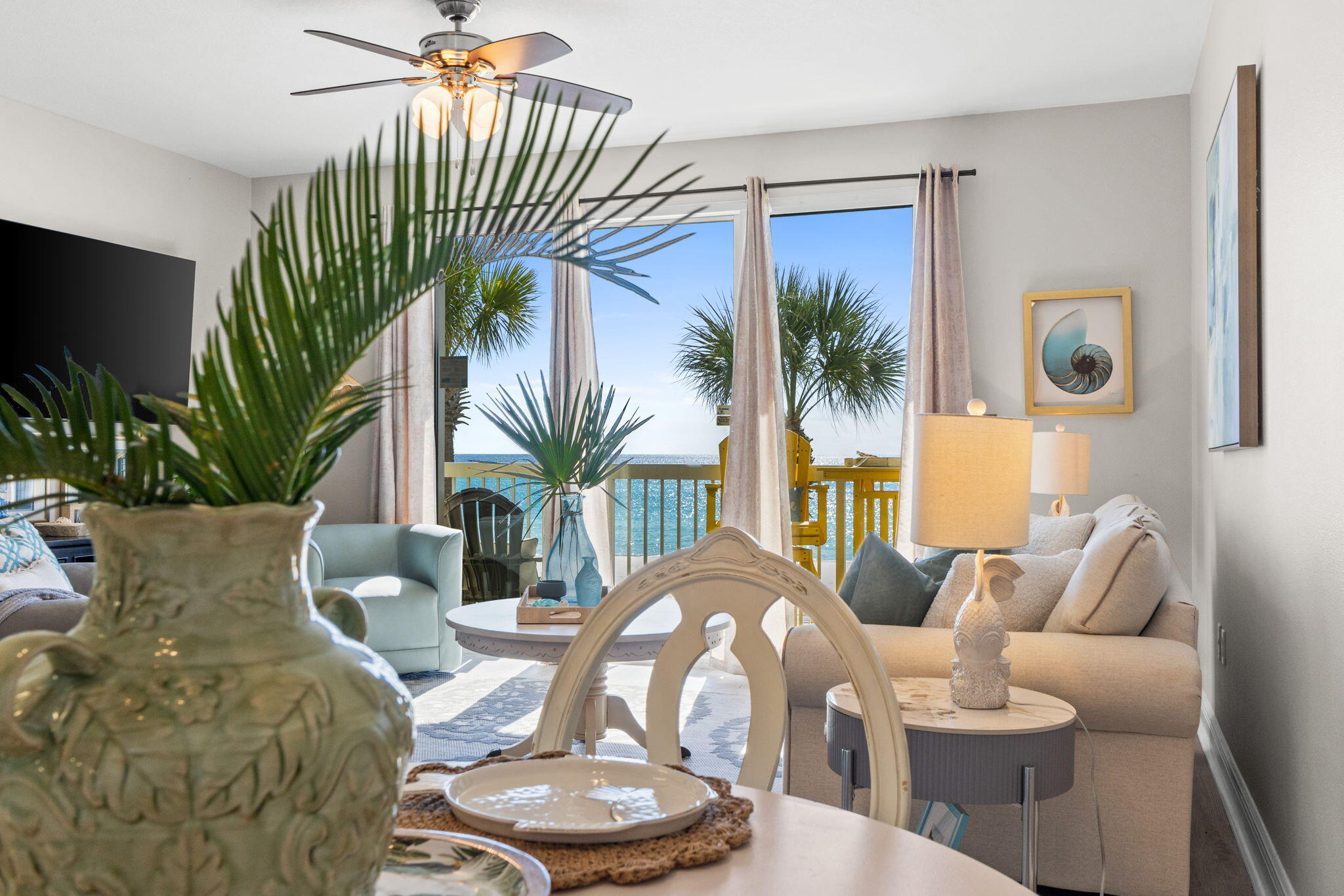 17757 Front Beach Road, Unit 104 Panama City Beach, FL 32413 - Photo 2 of 40 a living room with furniture and a potted plant