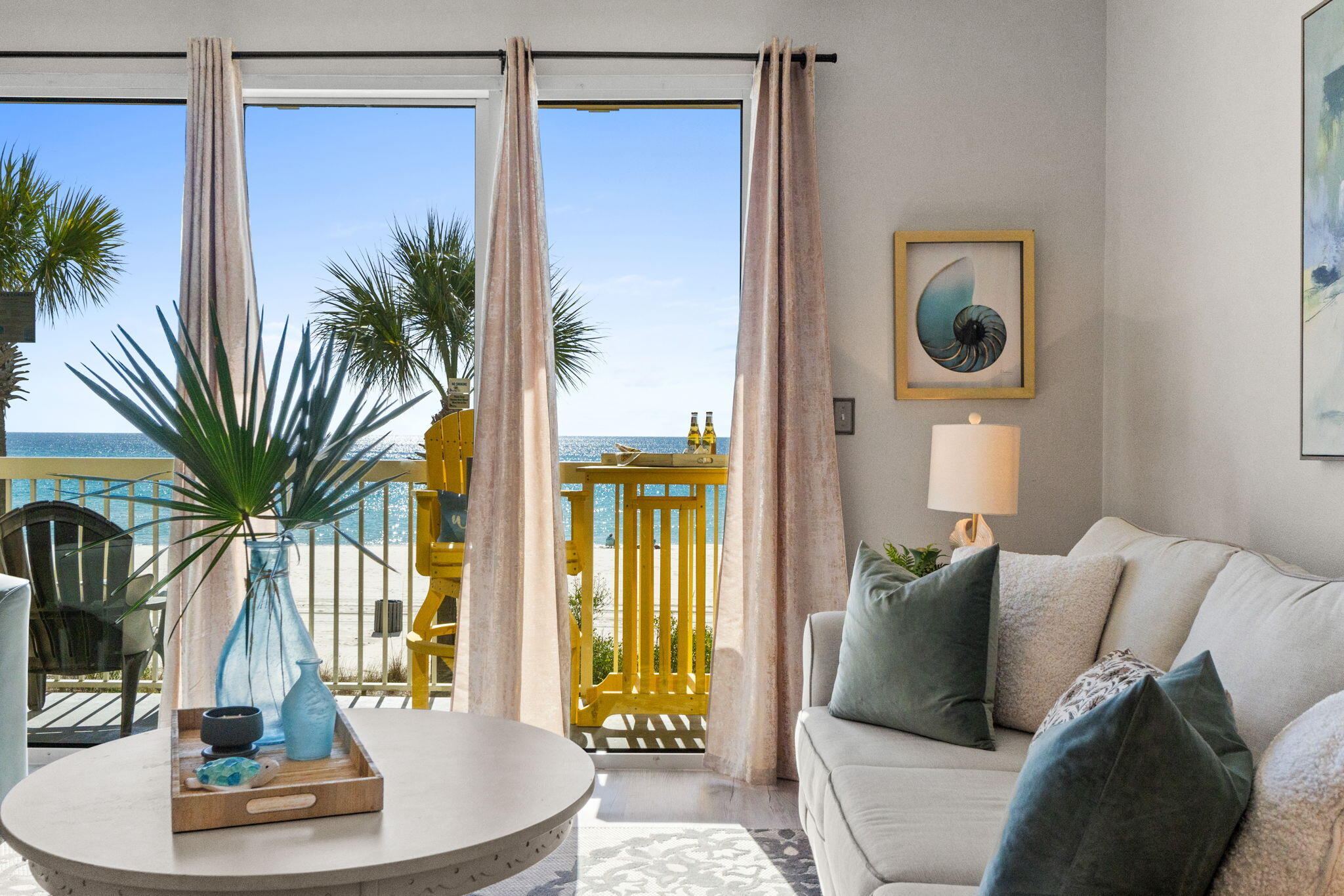 17757 Front Beach Road, Unit 104 Panama City Beach, FL 32413 - Photo 5 of 40 a living room with furniture and a potted plant