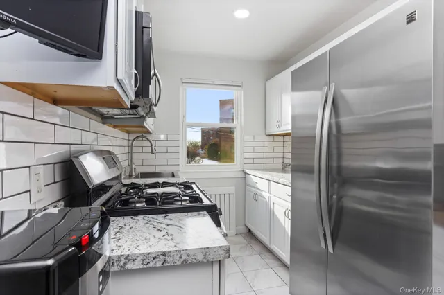 a kitchen with a stove and a refrigerator