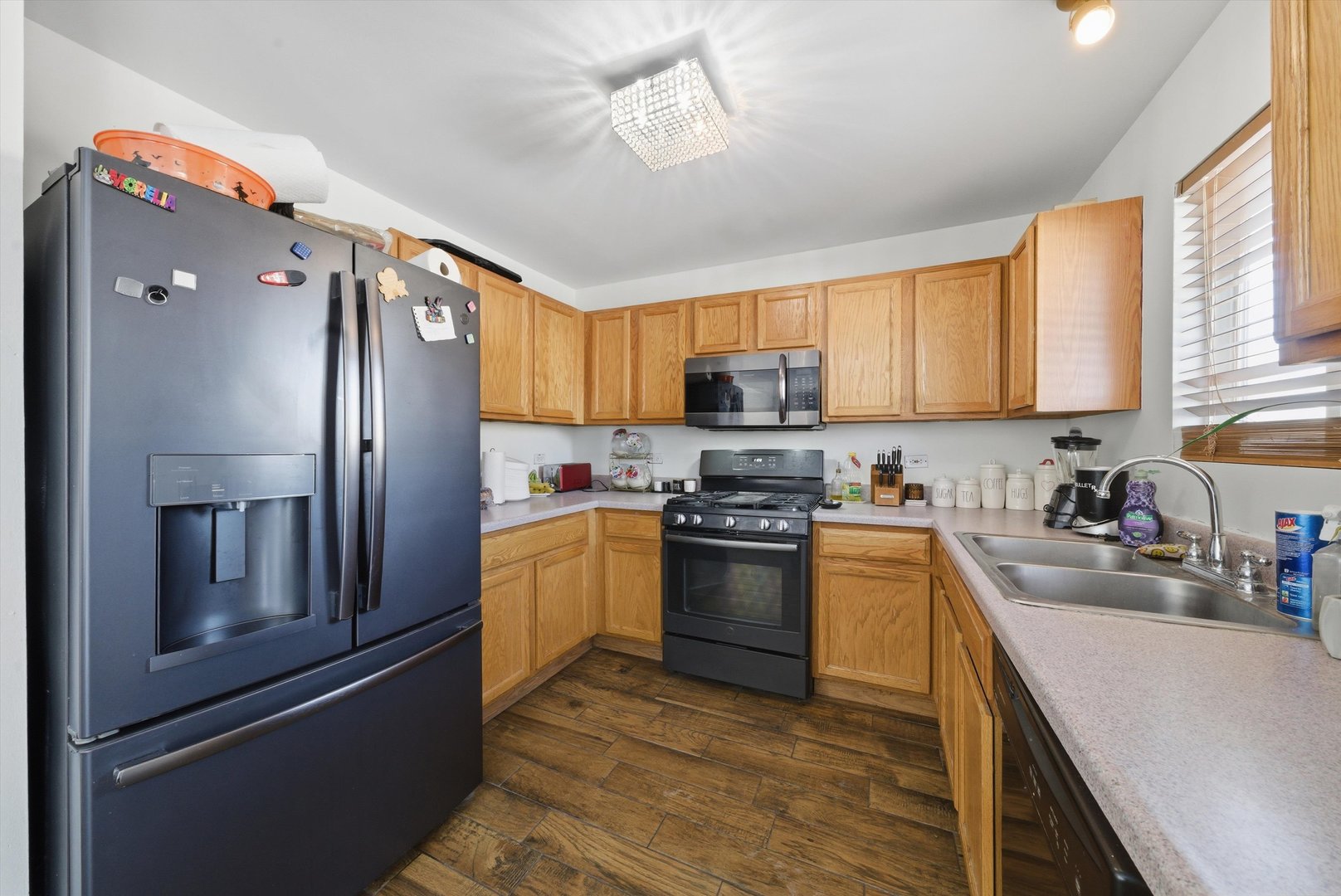 370 Dartmoor Avenue Romeoville, IL 60446 - Photo 13 of 31 a kitchen with stainless steel appliances granite countertop a refrigerator stove top oven a sink and dishwasher