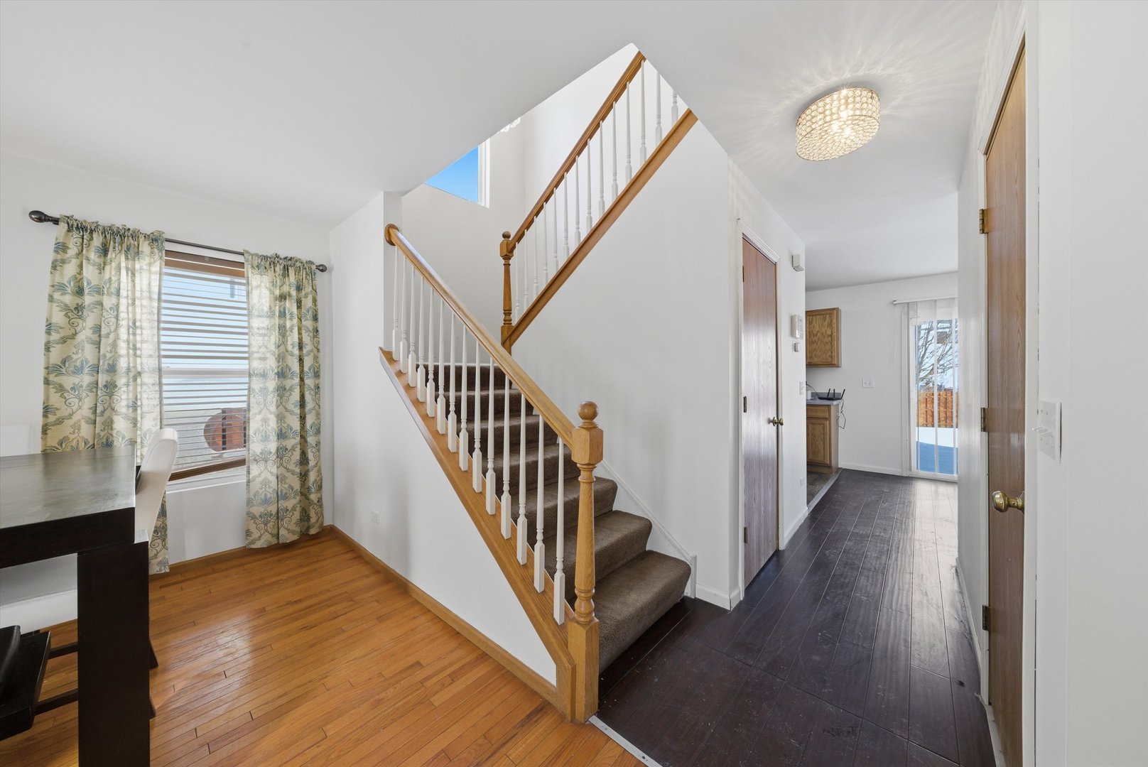 370 Dartmoor Avenue Romeoville, IL 60446 - Photo 6 of 31 a view of a hallway with windows and stairs