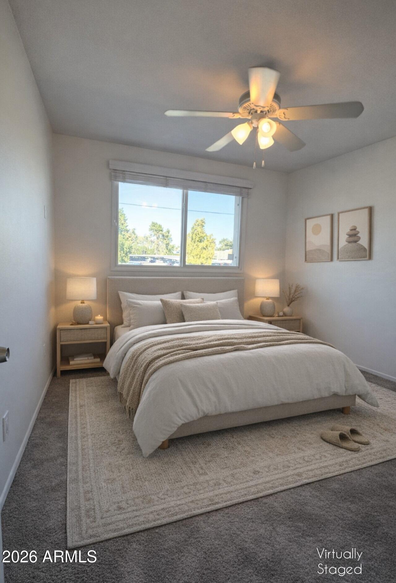 5853 East Thomas Road Scottsdale, AZ 85251 - Photo 13 of 18 a bedroom with a bed and a chandelier