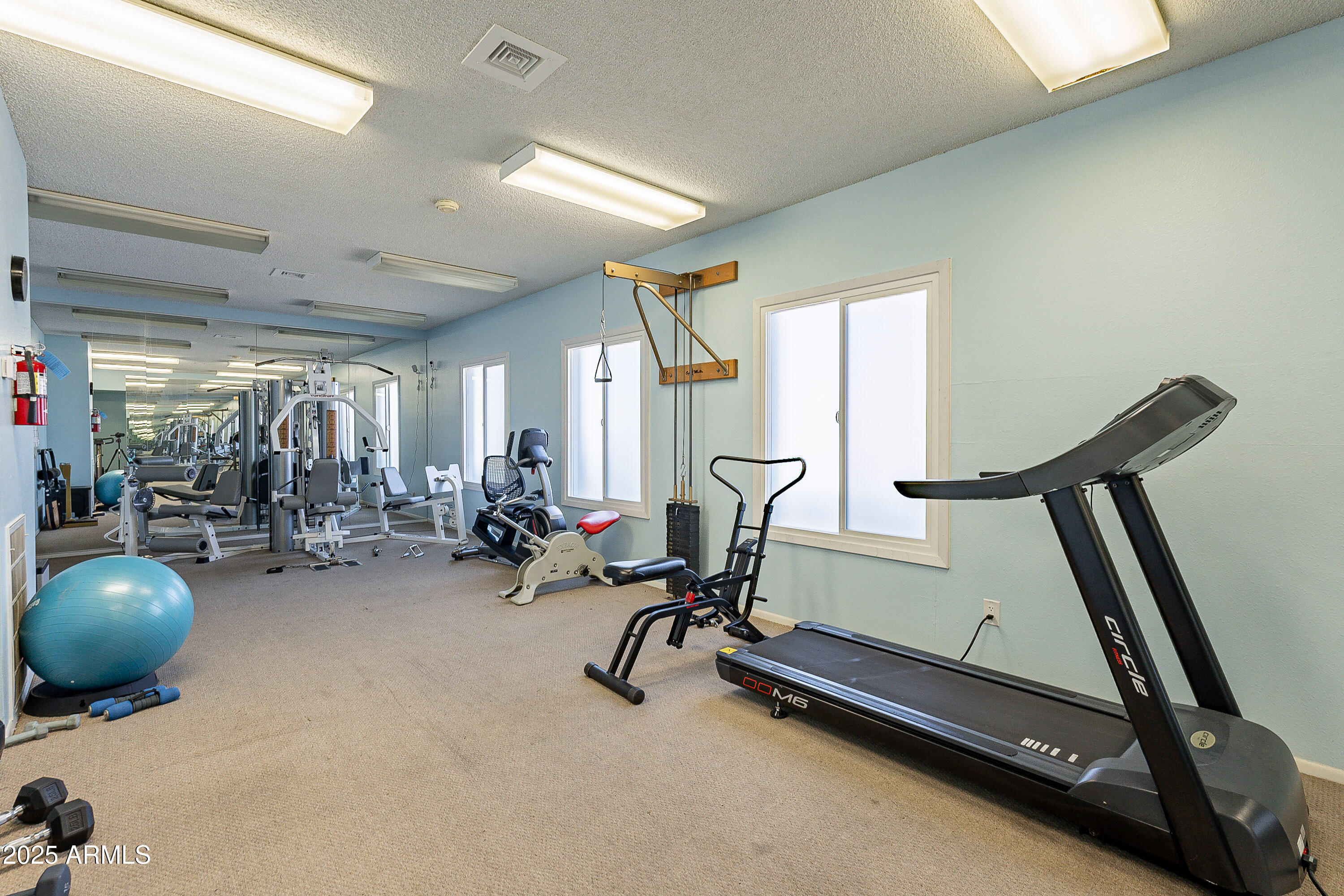 5853 East Thomas Road Scottsdale, AZ 85251 - Photo 18 of 18 a view of a room with gym equipment