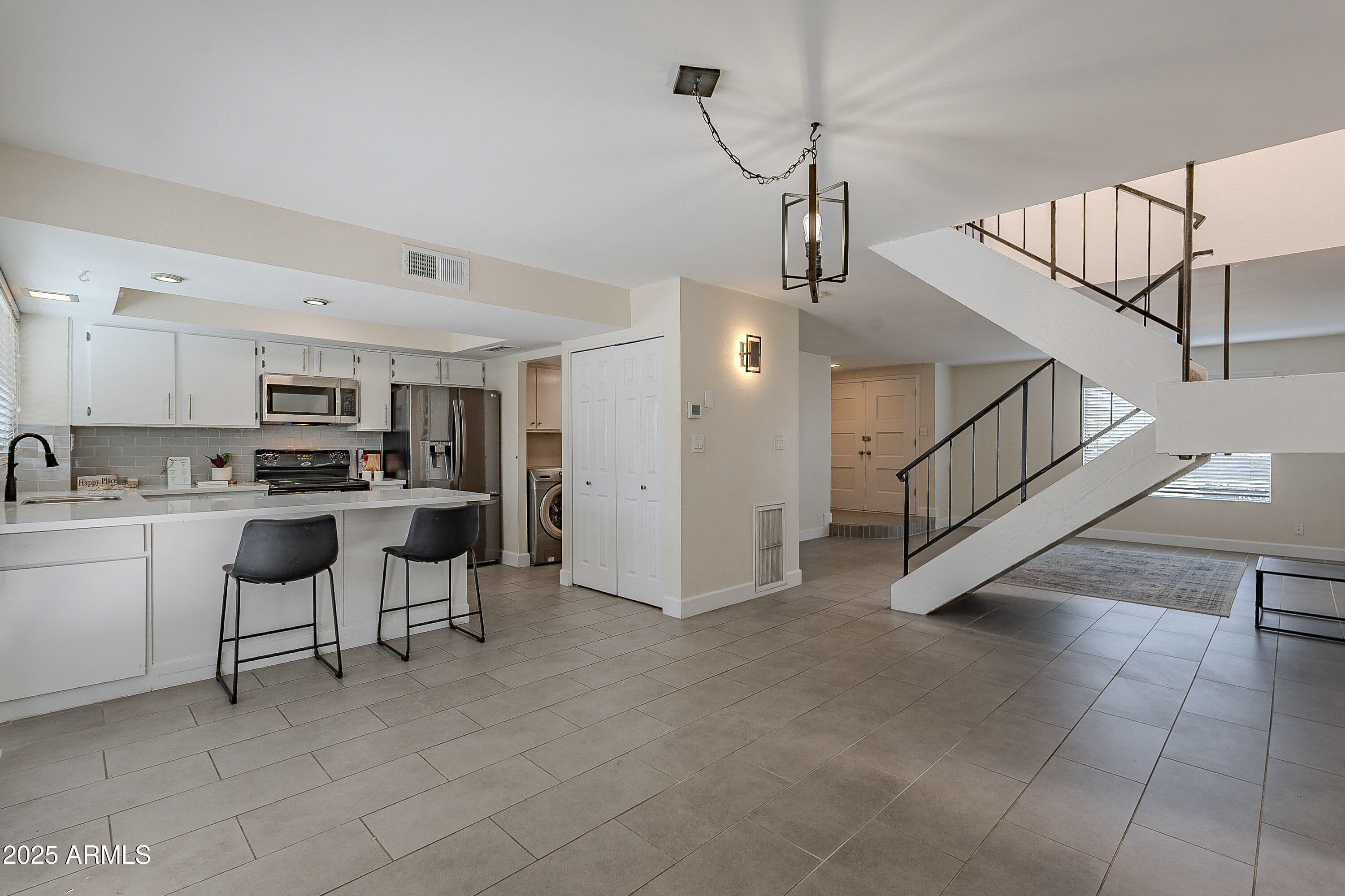 5853 East Thomas Road Scottsdale, AZ 85251 - Photo 3 of 18 a view of kitchen with furniture and electronic appliances
