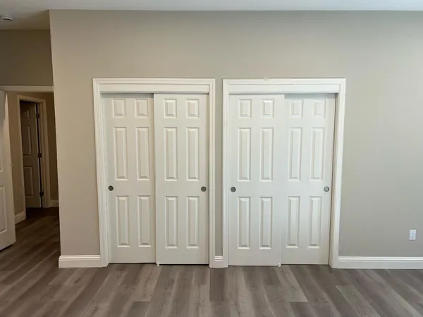 an empty room with wooden floor