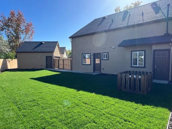 a view of a house with a yard