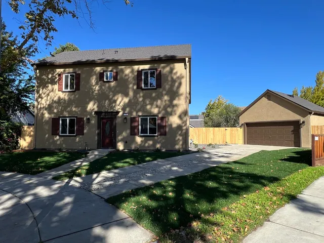 a view of house with yard